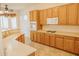 Bright kitchen with stainless steel appliances, granite countertops, and ample cabinet space at 13542 W Port Au Prince Ln, Surprise, AZ 85379