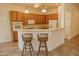 Bright kitchen featuring a breakfast bar with seating, stainless steel appliances, and ample cabinets at 13542 W Port Au Prince Ln, Surprise, AZ 85379