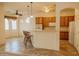 Bright kitchen featuring a breakfast bar with seating and stainless steel appliances at 13542 W Port Au Prince Ln, Surprise, AZ 85379