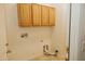 Laundry room with overhead cabinets and hookups at 13542 W Port Au Prince Ln, Surprise, AZ 85379