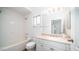 Bright bathroom features a shower/tub combo, toilet, vanity with sink, and neutral finishes at 1411 E Orangewood Ave # 123, Phoenix, AZ 85020