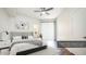 Comfortable bedroom featuring hardwood floors, ceiling fan, and lots of natural light at 1411 E Orangewood Ave # 123, Phoenix, AZ 85020