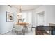 Cozy dining area with a round table, stylish chairs, and natural light at 1411 E Orangewood Ave # 123, Phoenix, AZ 85020