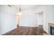 Dining room featuring wood-look flooring and views to other rooms at 1411 E Orangewood Ave # 123, Phoenix, AZ 85020