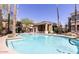 Inviting community pool with lounge chairs and meticulously maintained landscaping at 1411 E Orangewood Ave # 123, Phoenix, AZ 85020