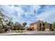 Street view of the 'The Legacy at Pinter Pea' community featuring well-manicured landscaping at 1411 E Orangewood Ave # 123, Phoenix, AZ 85020