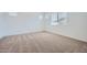 Bright and airy bedroom showcasing plush carpeting, clean white walls, and natural light from multiple windows at 15005 W Gray Fox Trl, Surprise, AZ 85387
