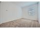 Bedroom featuring neutral carpet and window, creating a cozy and well-lit space at 15005 W Gray Fox Trl, Surprise, AZ 85387
