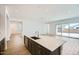Elegant kitchen with stainless steel appliances, a center island with a sink, and an open-concept layout at 15005 W Gray Fox Trl, Surprise, AZ 85387