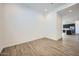 Bright, airy living room features light wood floors and recessed lighting at 15005 W Gray Fox Trl, Surprise, AZ 85387