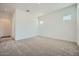 Bright bedroom with neutral carpet, offering a clean and inviting space at 15036 W Smoketree Dr, Surprise, AZ 85387