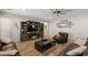 Comfortable living room featuring a large TV, entertainment center, and cozy seating at 15658 W Cortez St, Surprise, AZ 85379