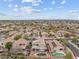 An aerial view of a neighborhood with a variety of single-Gathering homes, desert landscaping, and community amenities at 16533 W Carmen Dr, Surprise, AZ 85388