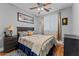 Comfortable bedroom with a ceiling fan, neutral walls, and coordinated furnishings at 16533 W Carmen Dr, Surprise, AZ 85388
