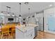 Bright kitchen boasts a farmhouse sink, stainless steel appliances, and a pantry with an open floor plan at 16533 W Carmen Dr, Surprise, AZ 85388