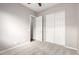 Bedroom features neutral colored walls, closet space, and a ceiling fan at 16771 W Adams St, Goodyear, AZ 85338