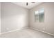 Bedroom features neutral colored walls and carpet with natural light from the window at 16771 W Adams St, Goodyear, AZ 85338