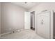 Bedroom features neutral carpet, a ceiling fan, and a large Champion brand safe at 16771 W Adams St, Goodyear, AZ 85338