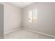 Bedroom features neutral colored walls and carpet with natural light from the window at 16771 W Adams St, Goodyear, AZ 85338