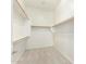 Walk-in closet includes shelving and wooden closet rods for maximum storage and organization at 16771 W Adams St, Goodyear, AZ 85338