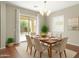 Charming dining room with a sliding glass door to the backyard at 16771 W Adams St, Goodyear, AZ 85338