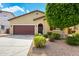 Charming single-story home featuring a well-maintained yard and a two-car garage at 16771 W Adams St, Goodyear, AZ 85338
