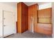 Garage interior showing cabinet storage and side entry door at 16771 W Adams St, Goodyear, AZ 85338