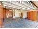 Spacious garage featuring ample cabinet storage and a clean concrete floor at 16771 W Adams St, Goodyear, AZ 85338