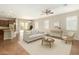 Bright and airy living room features a modern open floor plan and wood floors at 16771 W Adams St, Goodyear, AZ 85338