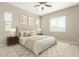 A calming main bedroom with a tufted headboard and neutral decor at 16771 W Adams St, Goodyear, AZ 85338