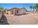Expansive backyard featuring a covered patio and low-maintenance gravel landscaping with the potential for various outdoor activities at 17008 W Sonora St, Goodyear, AZ 85338