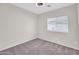 Bedroom featuring soft gray carpeting and a bright window with views to the outdoors at 17008 W Sonora St, Goodyear, AZ 85338