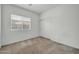 Cozy bedroom with a large window provides natural light at 17008 W Sonora St, Goodyear, AZ 85338
