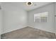 Bright bedroom with a ceiling fan and large window provides natural light at 17008 W Sonora St, Goodyear, AZ 85338