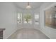 Bright dining area features neutral walls, tile flooring and three large windows at 17008 W Sonora St, Goodyear, AZ 85338