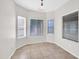 Cozy dining area features neutral paint, natural lighting, and tile flooring at 17008 W Sonora St, Goodyear, AZ 85338