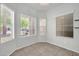 Bright dining area featuring neutral walls, tile flooring and three large windows at 17008 W Sonora St, Goodyear, AZ 85338