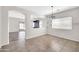 Bright dining area with neutral paint, open to other rooms, and tile flooring throughout at 17008 W Sonora St, Goodyear, AZ 85338
