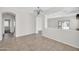 Open dining area featuring neutral paint, tile flooring and an elegant chandelier at 17008 W Sonora St, Goodyear, AZ 85338
