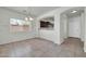 An open dining room area with tile flooring and natural light from the window at 17008 W Sonora St, Goodyear, AZ 85338