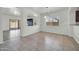Bright dining room features tile floors, natural light, and an open floor plan at 17008 W Sonora St, Goodyear, AZ 85338