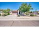 Charming single-story home features a well-maintained lawn and a two-car garage at 17008 W Sonora St, Goodyear, AZ 85338
