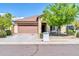 Charming single-story home showcasing a well-kept front yard, covered entry, and a two-car garage at 17008 W Sonora St, Goodyear, AZ 85338