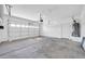 Spacious, attached two-car garage with painted walls and concrete floor, equipped with automatic door opener at 17008 W Sonora St, Goodyear, AZ 85338