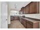 Open kitchen featuring tile floors, stainless steel appliances, and ample cabinet space at 17008 W Sonora St, Goodyear, AZ 85338