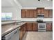 Bright and modern kitchen with stainless steel appliances and lots of cabinets at 17008 W Sonora St, Goodyear, AZ 85338