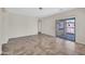 Bright, open living room features tile flooring and a sliding glass door leading to outdoor area at 17008 W Sonora St, Goodyear, AZ 85338
