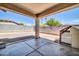 A covered patio space featuring concrete flooring with a small area for entertaining off the main house at 17008 W Sonora St, Goodyear, AZ 85338