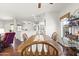 Dining area with wood flooring, ceiling fan, and view of the kitchen at 18137 N Plaza Ct, Surprise, AZ 85374