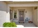 Inviting front porch with tiled entryway and decorative security door, creating a welcoming space at 18137 N Plaza Ct, Surprise, AZ 85374